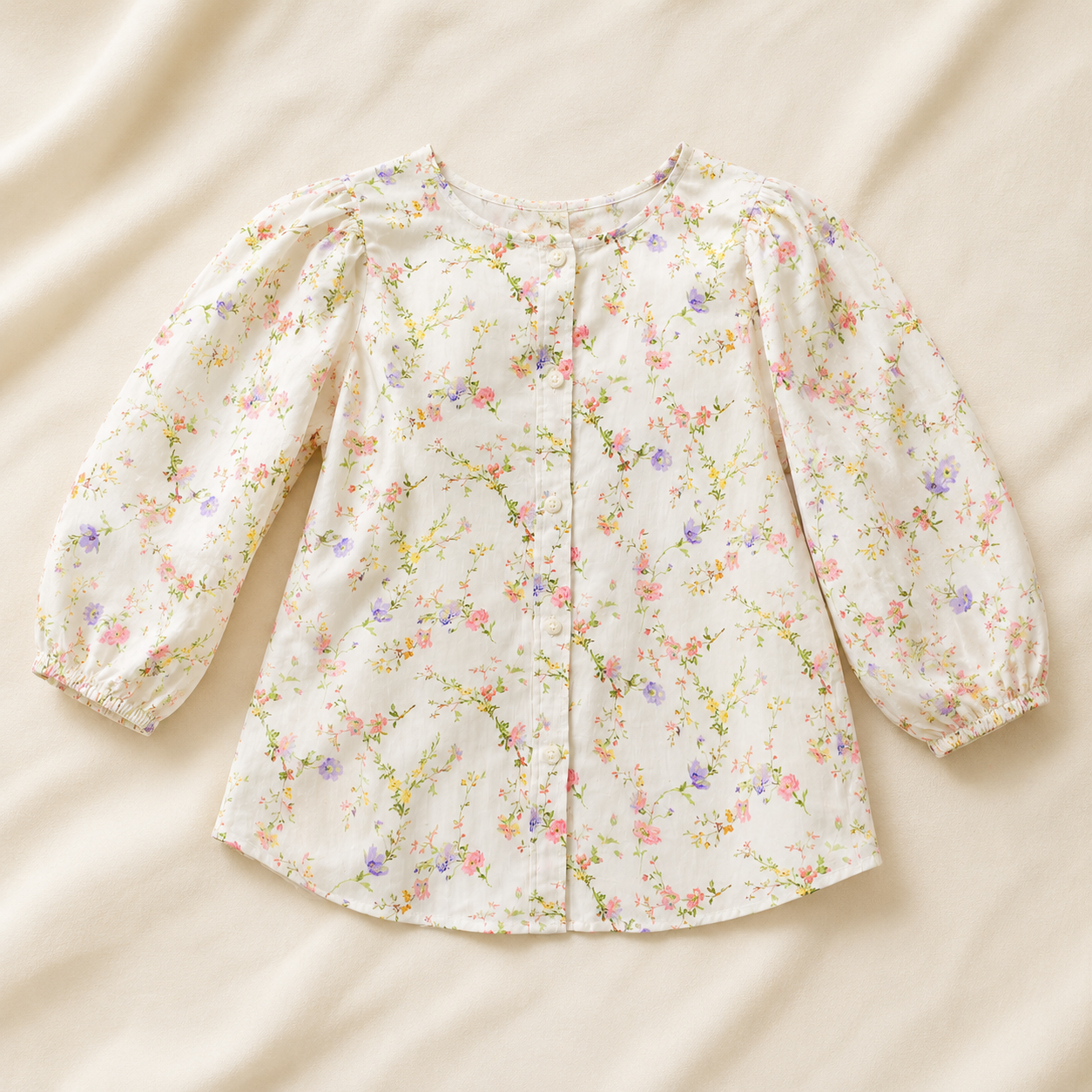 Garment laid flat on cream fabric.