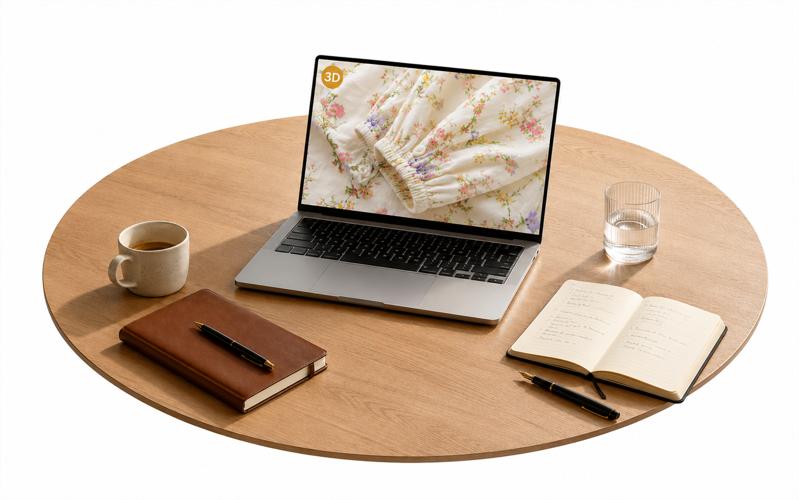 A round meeting table photographed from above with a laptop centered, showing a close-up detail of the floral blouse 3D Twin on screen, a coffee cup and closed notebook on one side and a water glass and open notebook on the other.