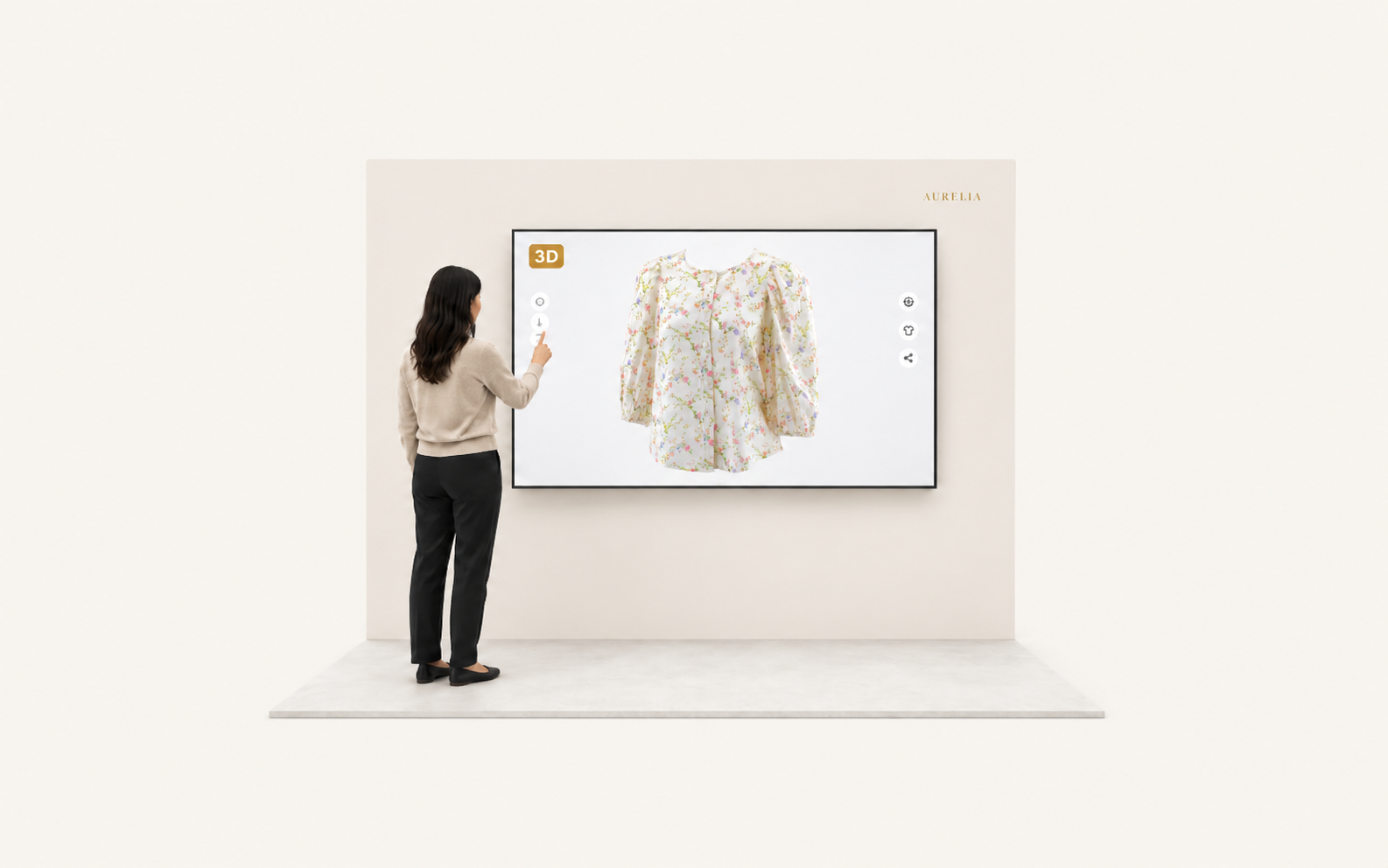 A trade show booth with a large wall-mounted touchscreen showing the floral blouse 3D Twin and a gold 3D badge, a visitor standing in front of the screen in back view, reaching to touch it.
